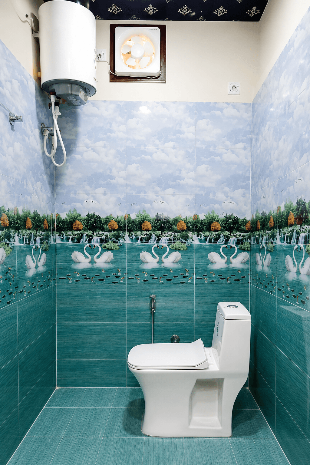 Clean attached bathroom with hot water geyser